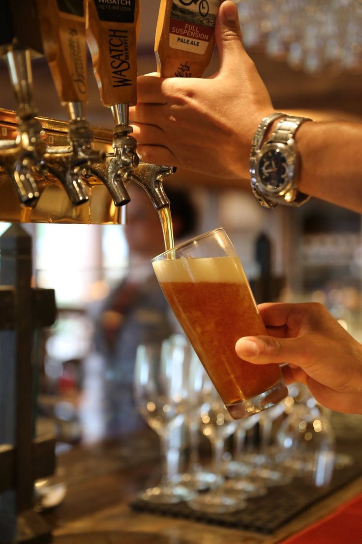 Beer taps pouring a fresh pint